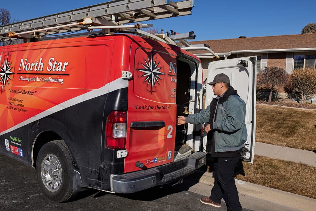 North Star Heating & Air Conditioning technician in their hvac work vehicle in Utah.